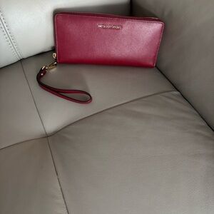 Michael Kors deep red matching wallet.